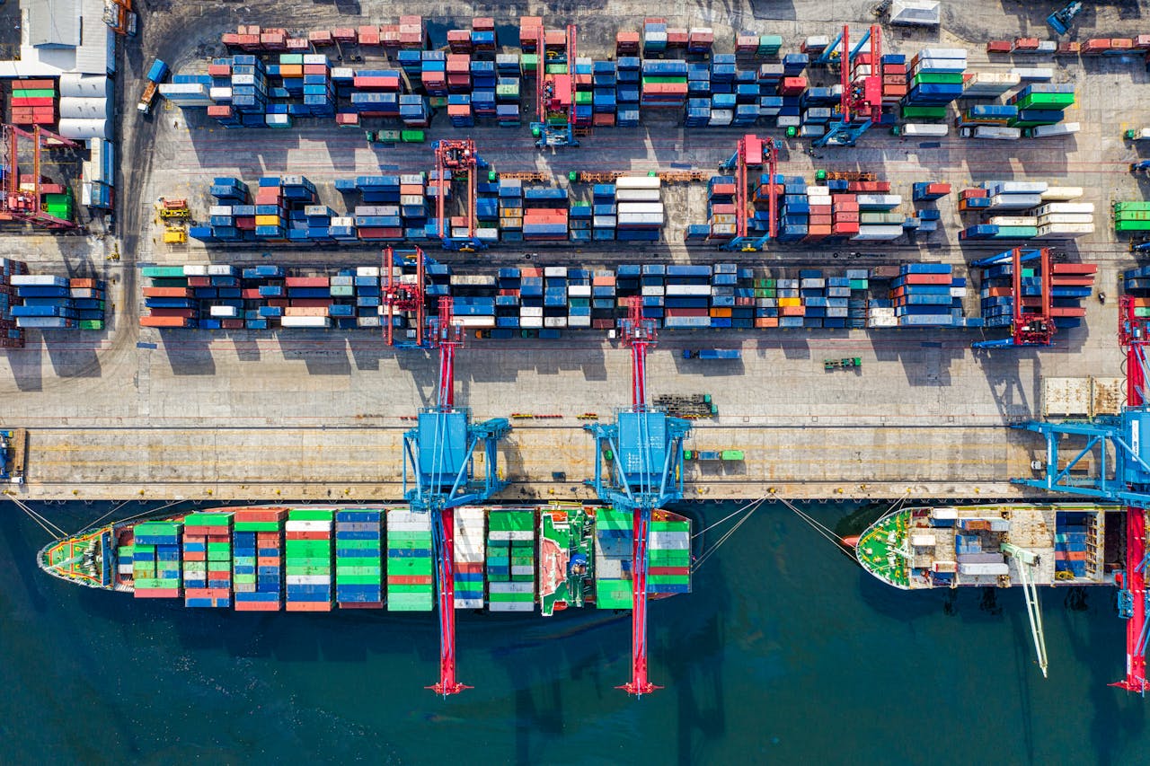services-04 Drone shot capturing vibrant container ships and dock in North Jakarta port, Indonesia.